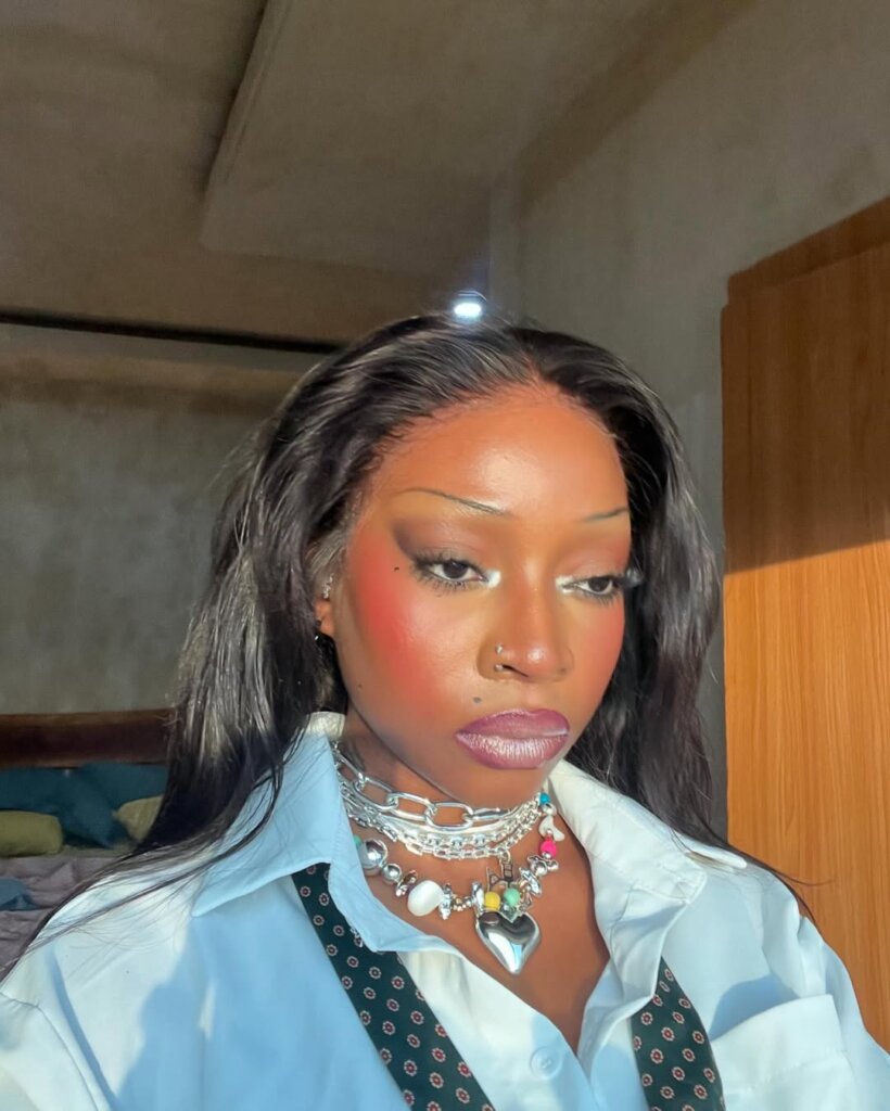 Ashley Okoli on Y2K beauty trend of Rosy cheeks and pencil-thin brows