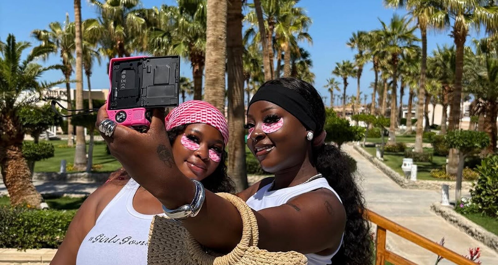 Chef Yo and her friend on holiday wearing the Topicals Faded Eye Mask via @tthatchefyo on Instagram