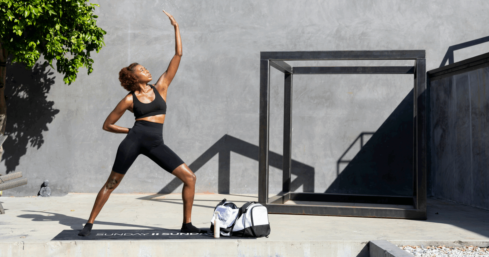 A black woman practising yoga by Sunday II Sunday via unsplash