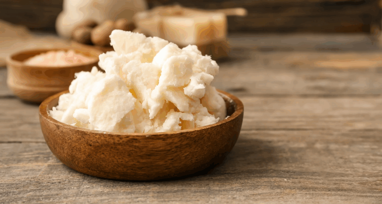 Shea ban; A small wooden bowl of shea butter via Vitamin USA