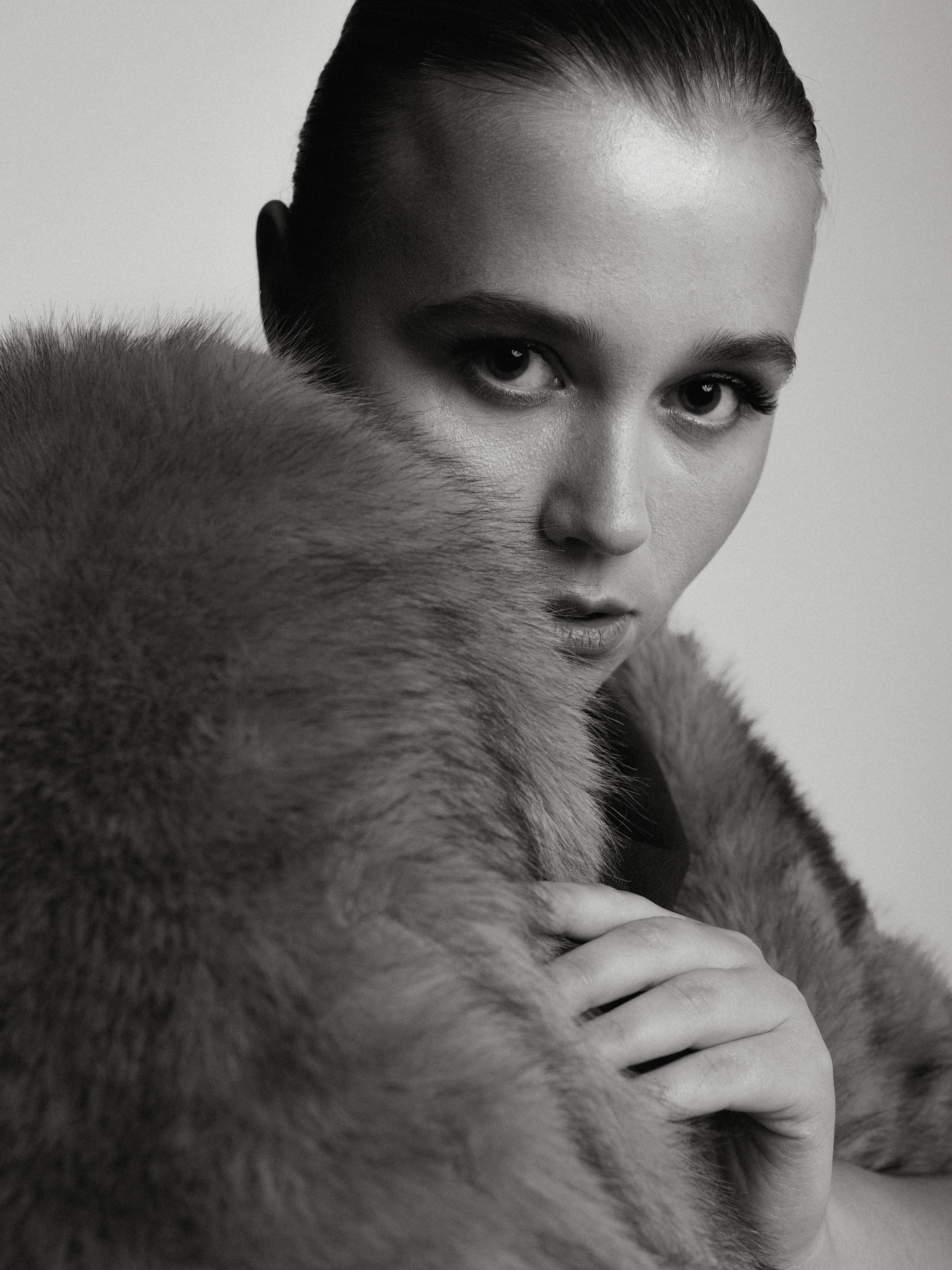 A black and white portrait of Daria Nazarova.