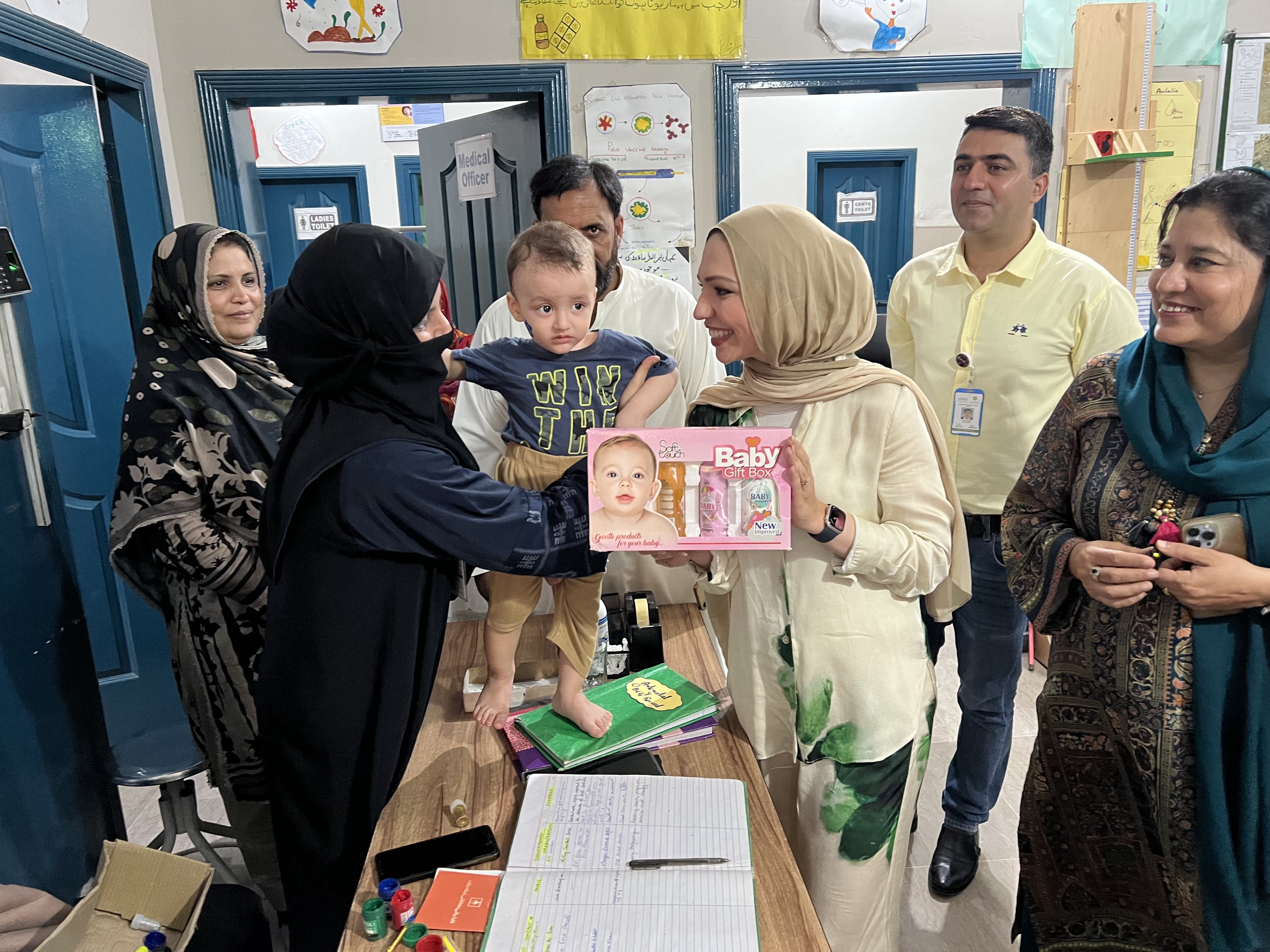 Photograph Isra Chaker working with women and children for her organisation Every Pregnancy via Isra Chaker