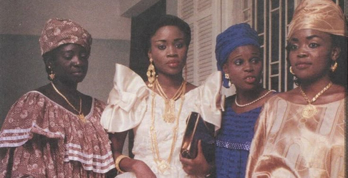 Old photo of four women wearing traditional attires via Pinterest