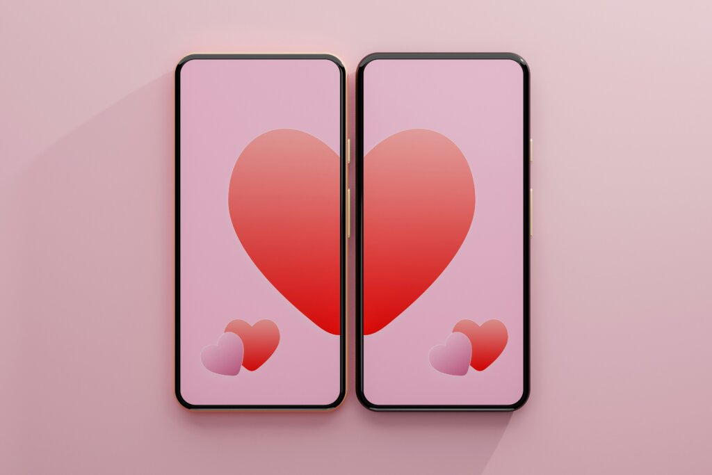 Two smart phones with half a heart each by Philip Oroni via Unsplash+