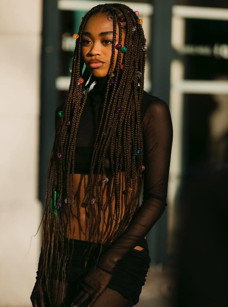 Alt Image: Braids accented with playful bubble hair accessories, captured by USSIN YALA for Getty Images