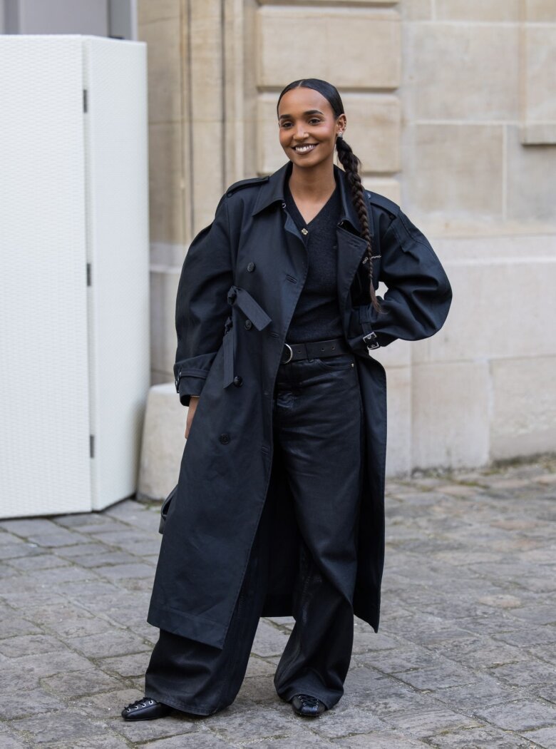 PFW guest with a middle-part low ponytail by RAIMONDA KULIKAUSKIENE via GETTY IMAGES.