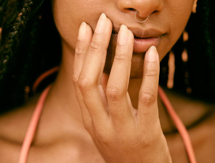 Close up shot of a black woman by Natlia Blauth via Unsplash