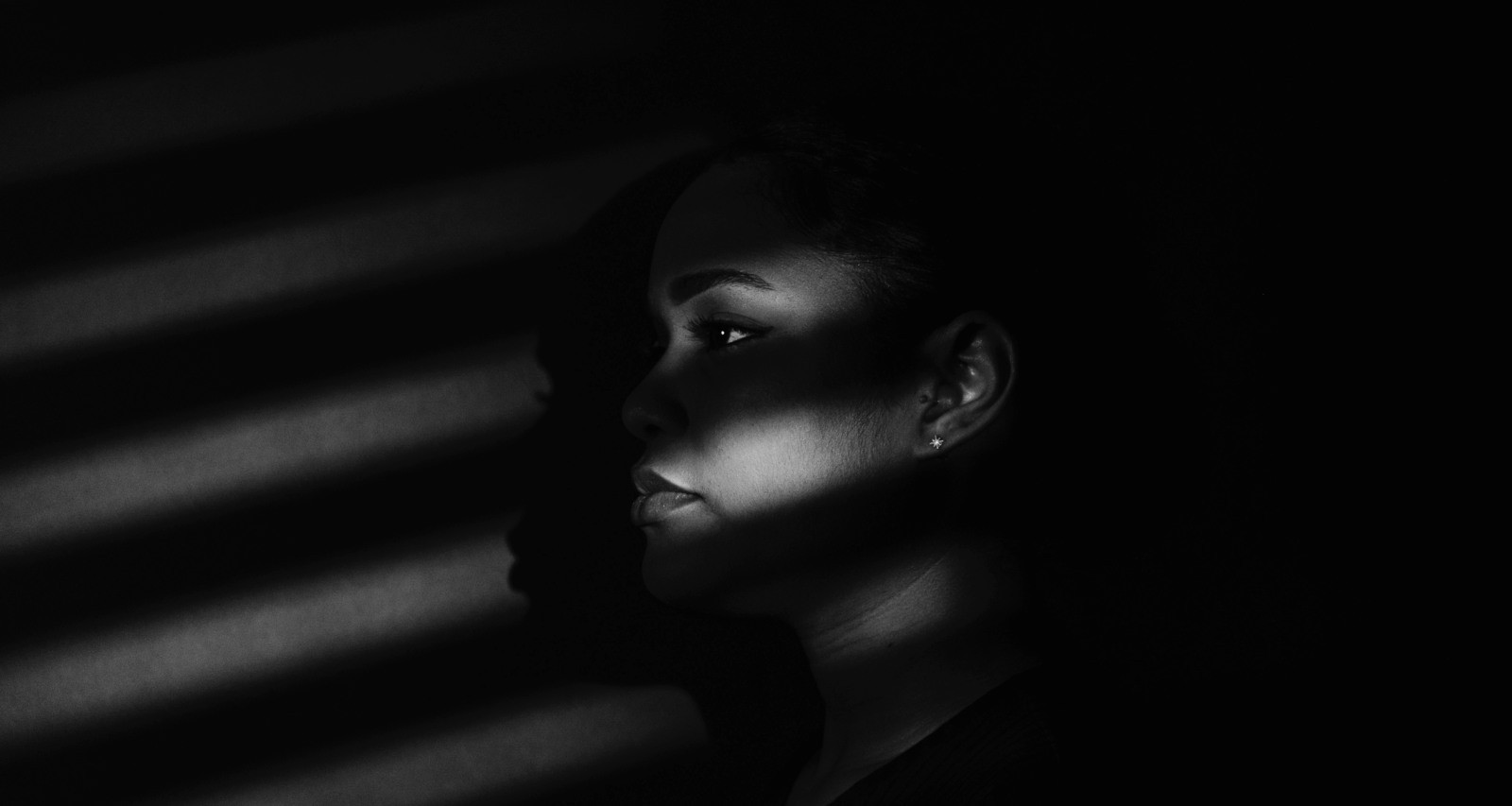 A portrait of a Black woman via Unsplash.