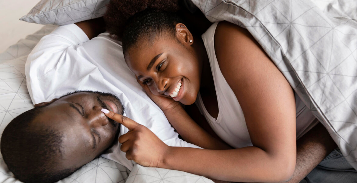 A married couple cuddling in the bedroom va Freepik