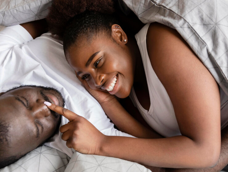 A married couple cuddling in the bedroom va Freepik