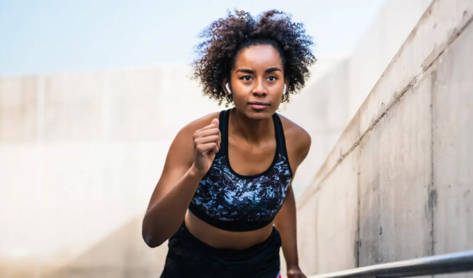 A black woman jogging via Shutterstock